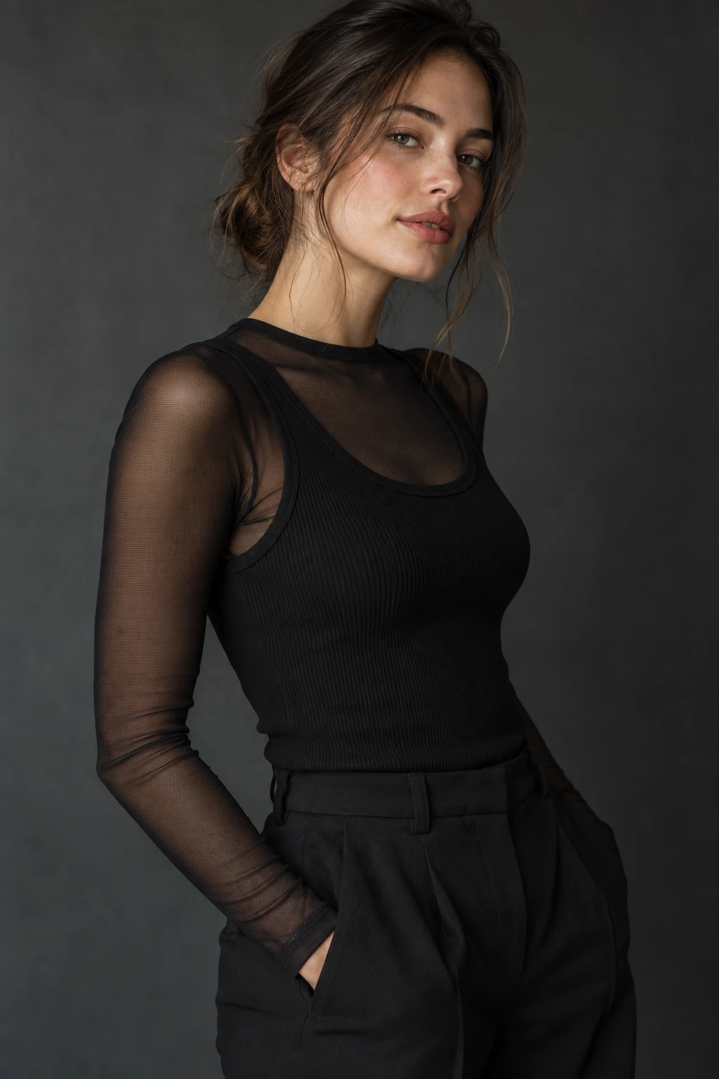 Black sheer mesh long sleeve layered under a solid black ribbed tank